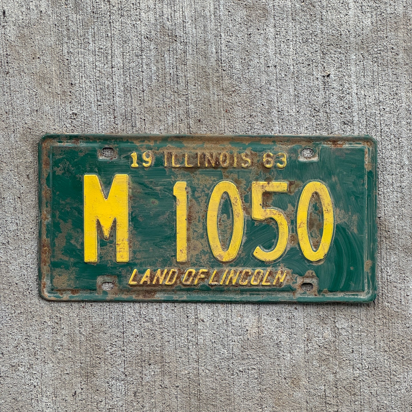 Photo of a 1963 Illinois Municipal License Plate Auto Tag 2 Vintage Garage M 1050 with original patina
