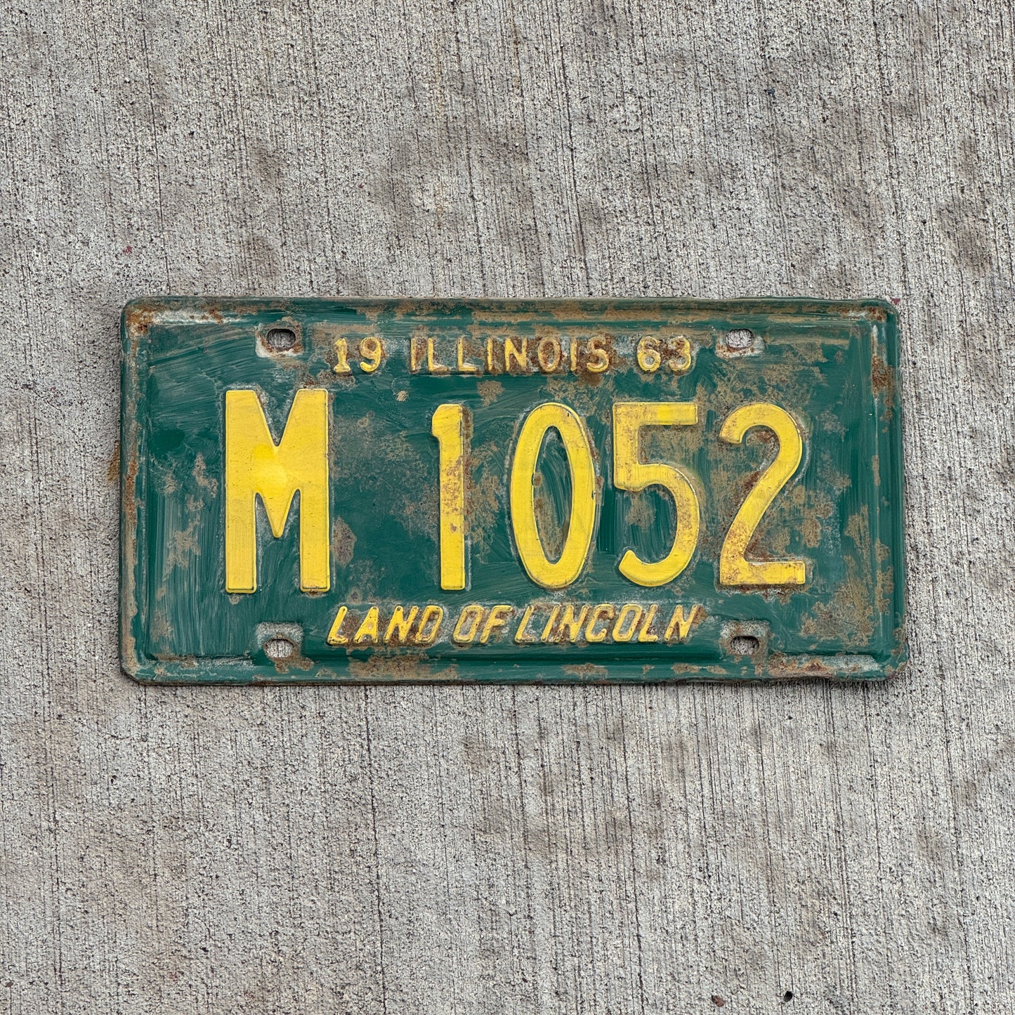 Photo of a 1963 Illinois Municipal License Plate Auto Tag 2 Vintage Garage M 1052 with original patina