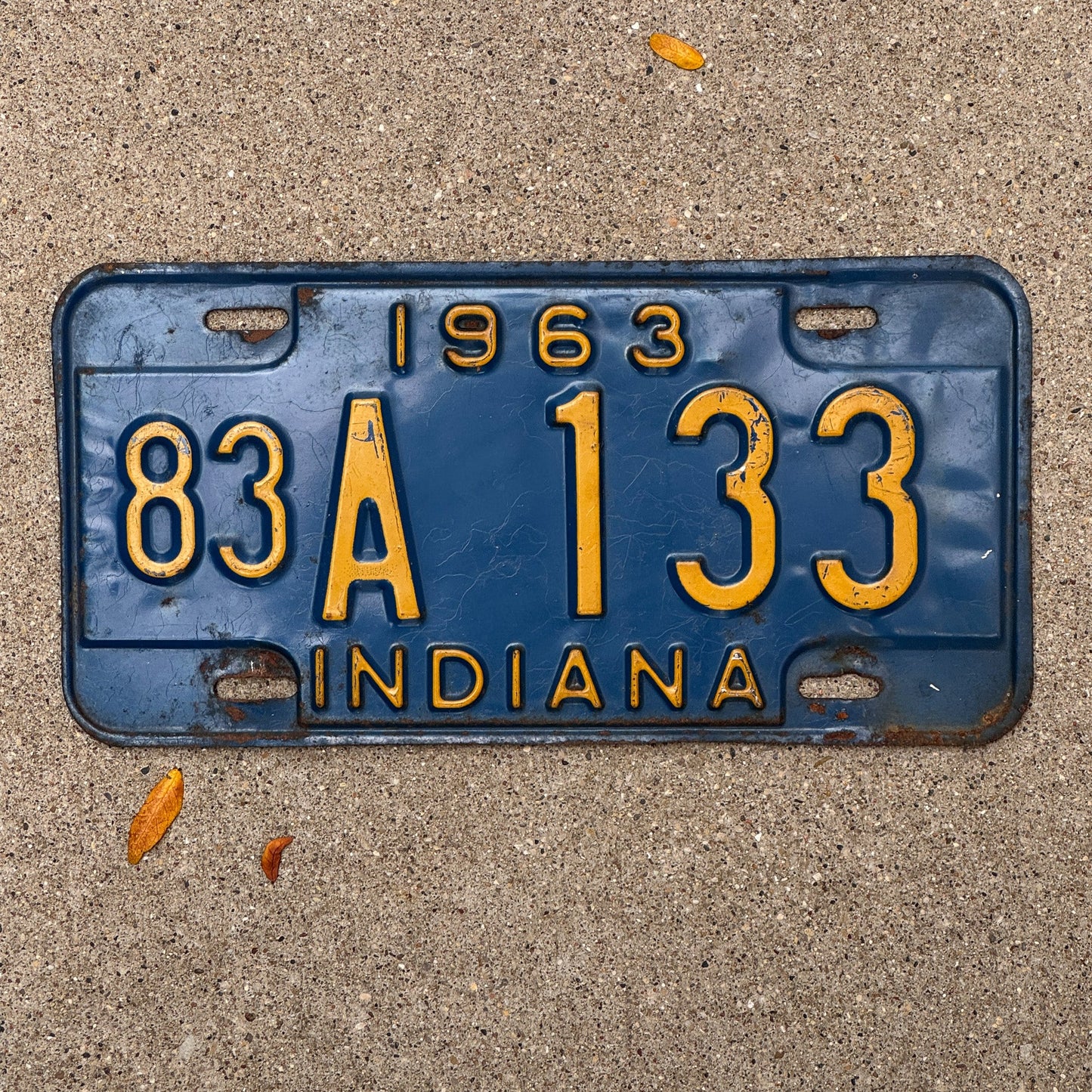 Photo of a 1963 Indiana License Plate Auto Tag Garage Decor Vintage 83 A 133 with original patina