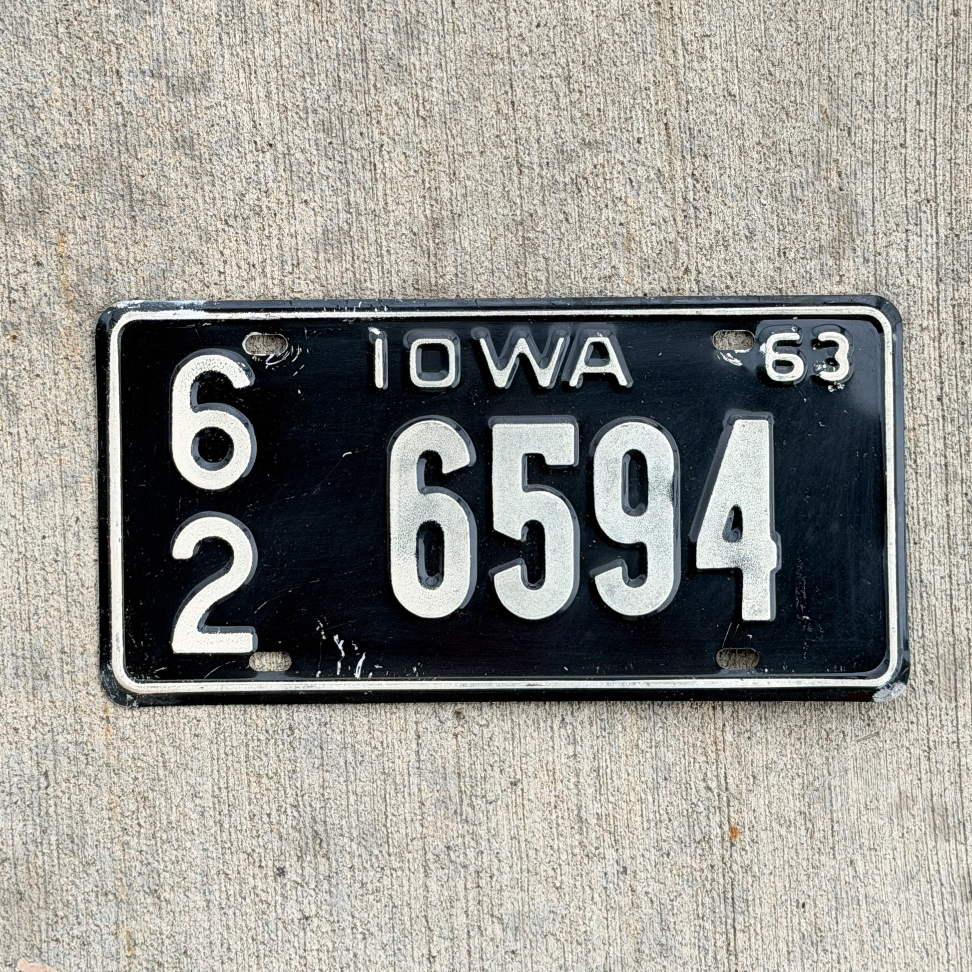 Photo of a 1963 Iowa License Plate Auto Tag Garage Decor Vintage 62 6594 with original patina