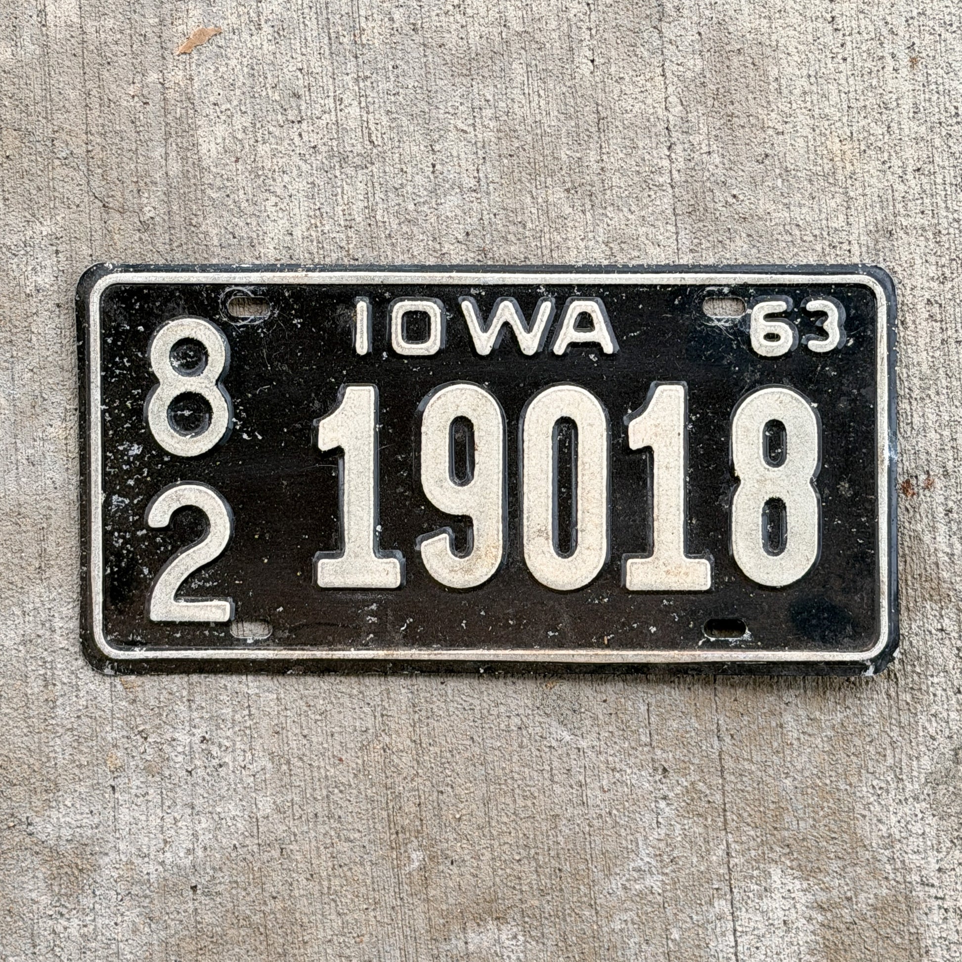 Photo of a 1963 Iowa License Plate Auto Tag Garage Decor Vintage 82 19018 with original patina