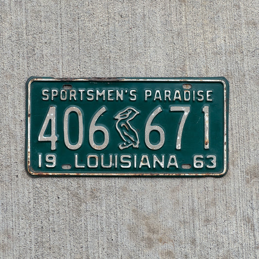 Photo of a 1963 Louisiana License Plate Auto Tag Garage Decor Vintage Iconic Pelican 406 671 with original patina
