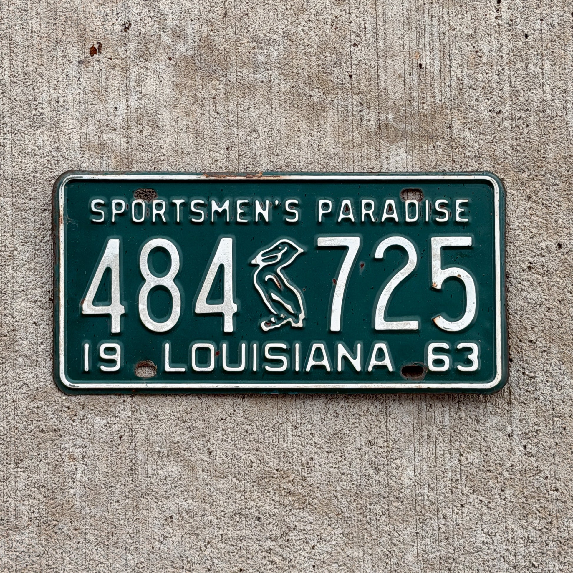 Photo of a 1963 Louisiana License Plate Auto Tag Garage Decor Vintage Iconic Pelican 484 725 with original patina