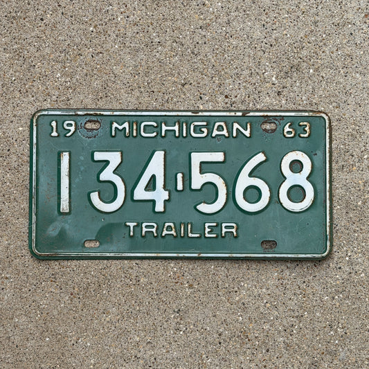 Photo of a 1963 Michigan Trailer License Plate Auto Tag Garage Decor Vintage 134 568 with original patina