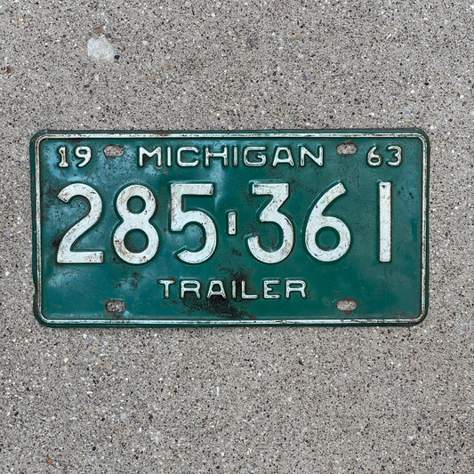 Photo of a 1963 Michigan Trailer License Plate Auto Tag Garage Decor Vintage 285 361