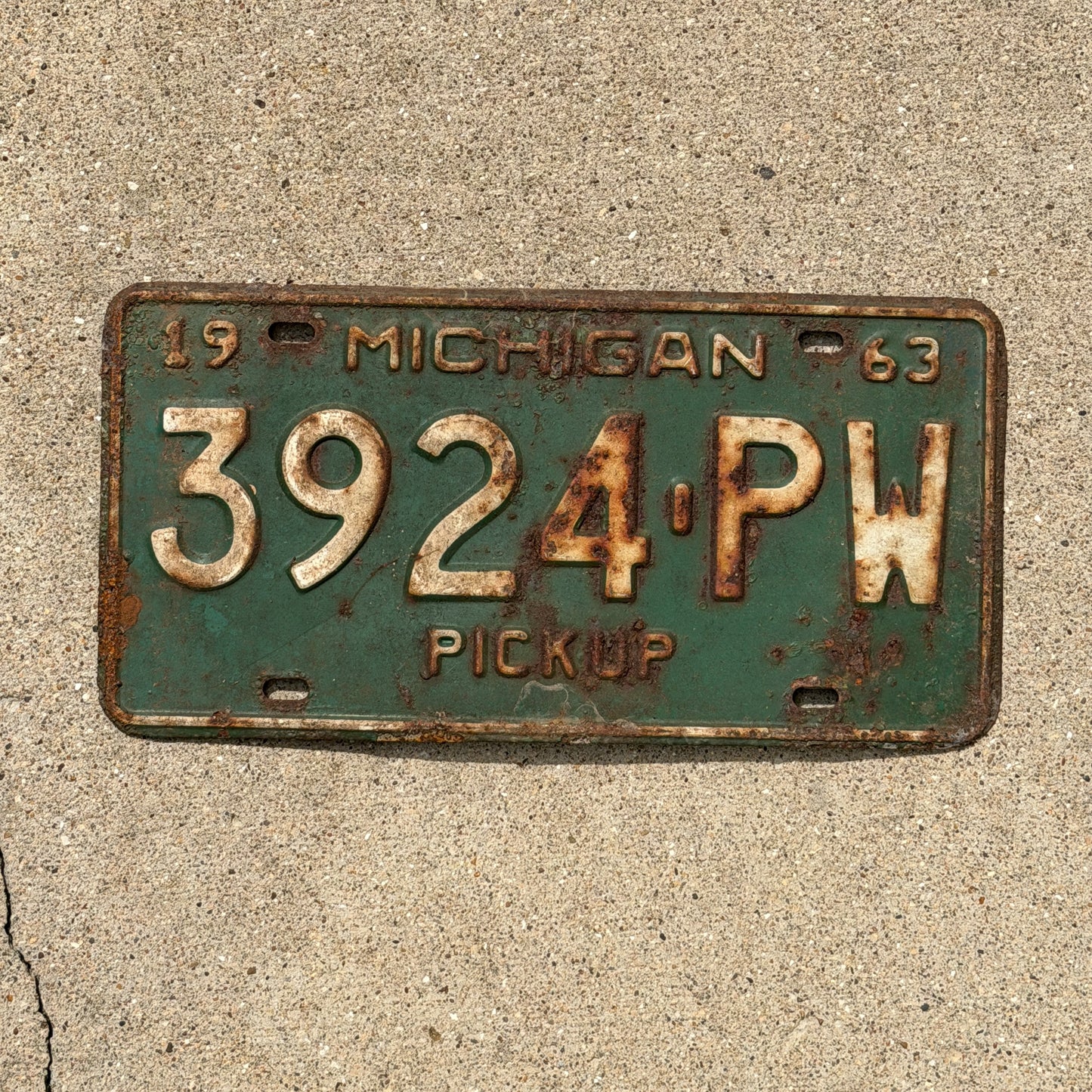 Photo of a 1963 Michigan Truck License Plate Auto Tag Garage Decor Vintage Pickup 3924 PW with original patina