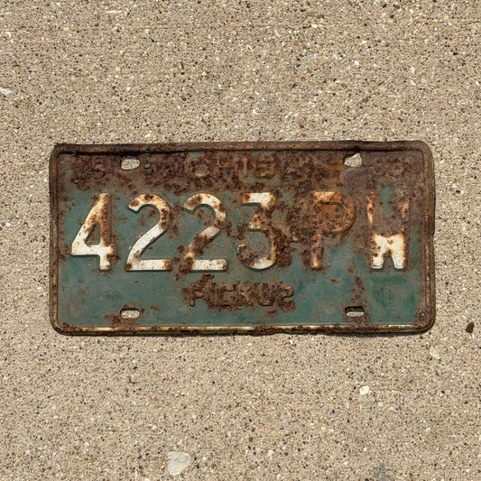 Photo of a 1963 Michigan Truck License Plate Auto Tag Garage Decor Vintage Pickup 4223 PW with original patina