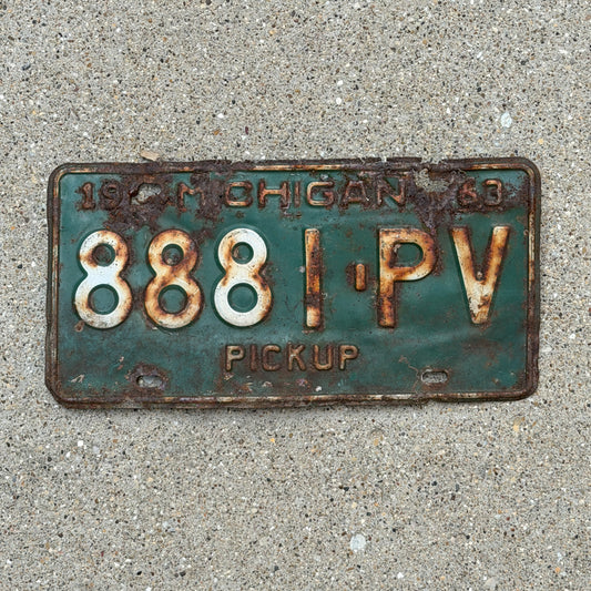 Photo of a 1963 Michigan Truck License Plate Auto Tag Garage Decor Vintage Pickup 8881 PV with original patina