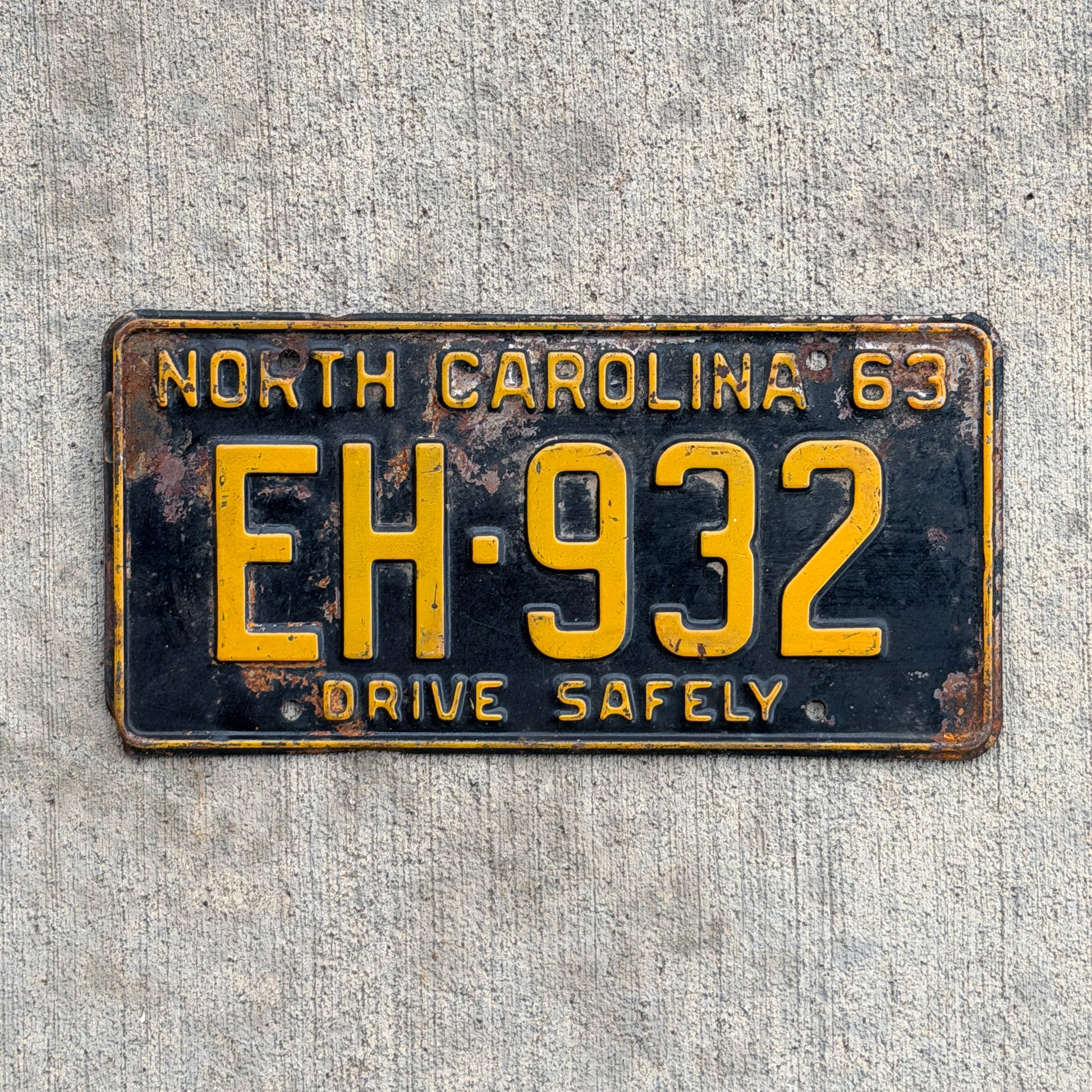 Photo of a 1963 North Carolina License Plate Auto Tag Garage Decor Vintage EH 932 with original patina