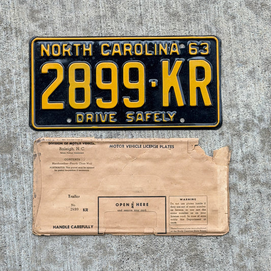 Photo of a 1963 North Carolina Trailer License Plate Auto Tag Garage Decor Vintage High Quality NOS With Envelope 2899 KR with original patina