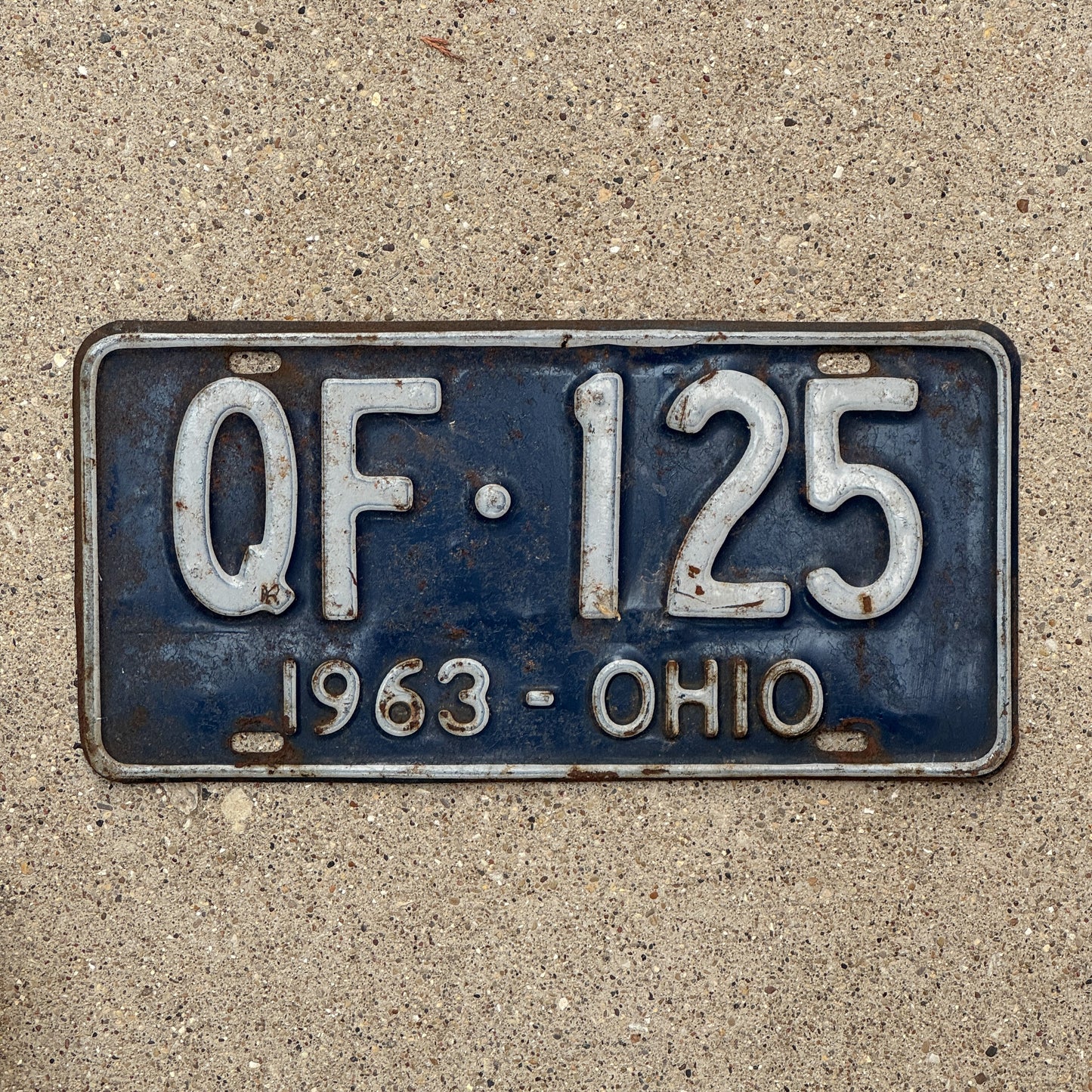Photo of a 1963 Ohio License Plate Auto Tag 1 Vintage Garage QF 125 with original patina