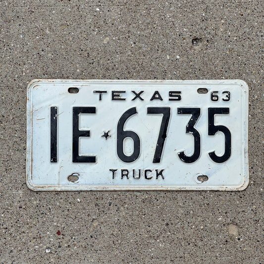 Photo of a 1963 Texas Truck License Plate Auto Tag Garage Decor Vintage IE 6735 with original patina