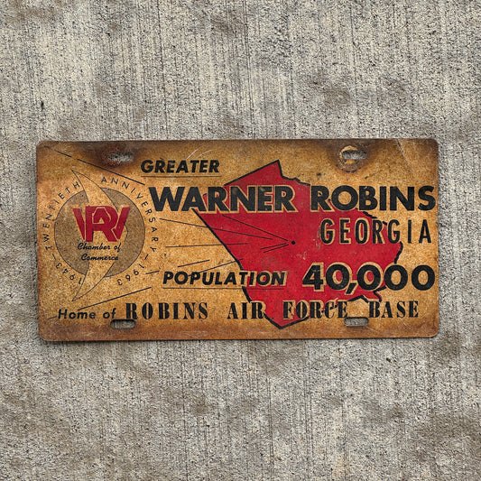 Photo of a 1963 Warner Robins Georgia Booster License Plate Auto Tag Garage Decor Vintage Robins Airforce Base with original patina