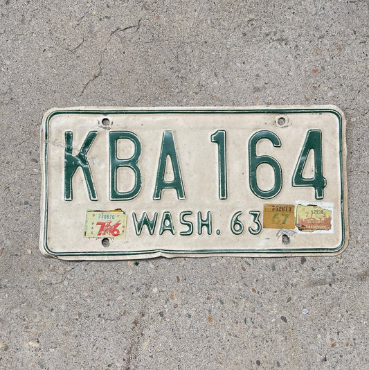 Photo of a 1963 Washington Auto Tag Garage Decor Vintage YOM DMV Clear KBA 164 with original patina
