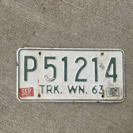 Photo of a 1963 Washington License Plate Auto Tag Garage Decor Vintage YOM DMV Clear P 51214 with original patina