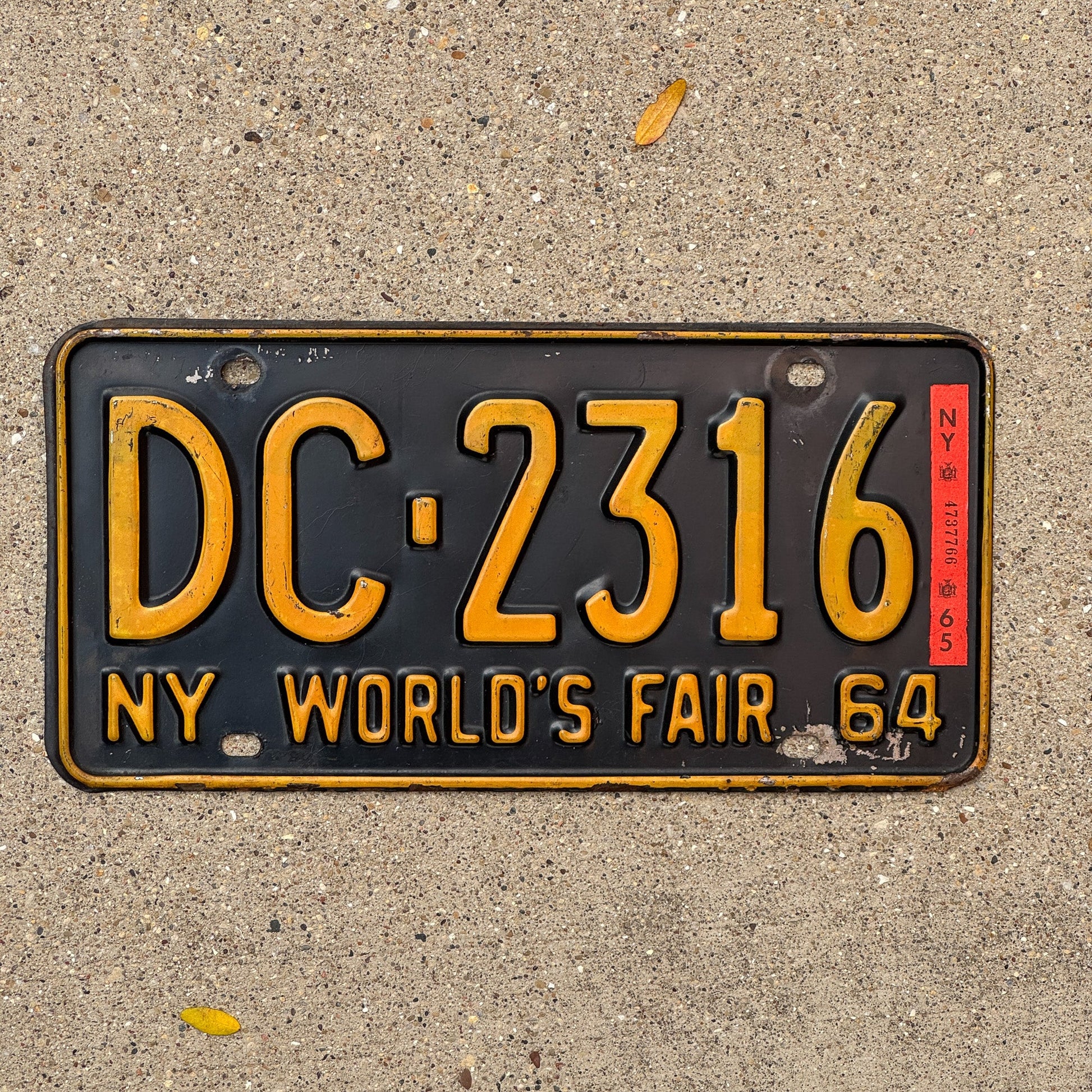 Photo of a 1964 1965 New York License Plate Auto Tag Garage Decor Vintage World's Fair DC 2316 with original patina