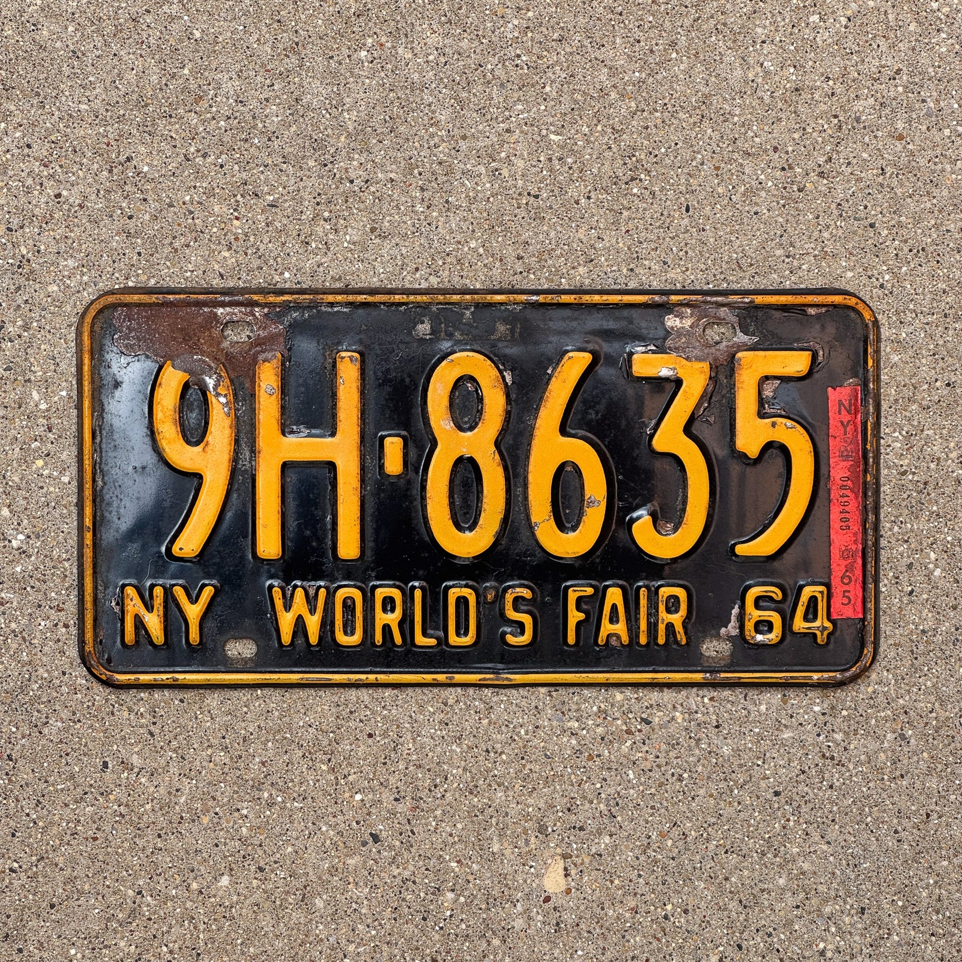 Photo of a 1964 1965 New York Special Omnibus License Plate Auto Tag Garage Decor Vintage World's Fair Bus 9H 8635 with original patina
