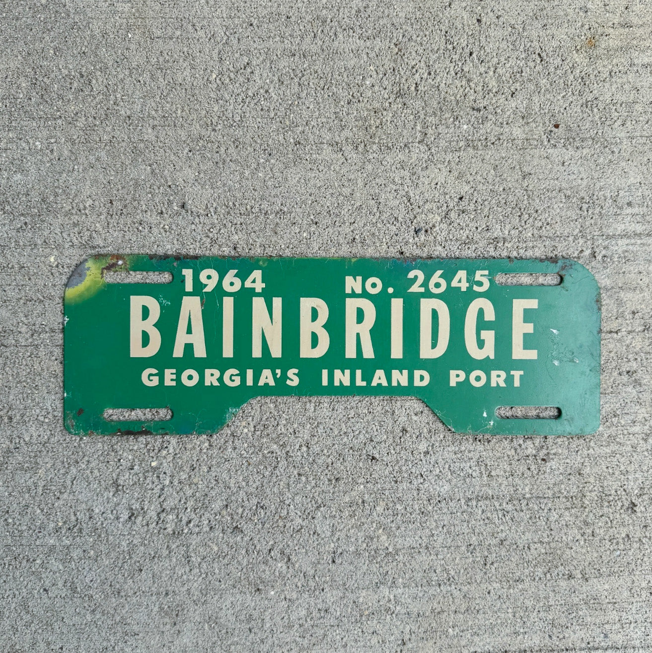 Photo of a 1964 Bainbridge Georgia License Plate Topper Auto Tag Garage Decor Vintage Inland Port Vintage Auto GA 2645 with original patina