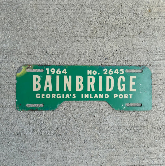 Photo of a 1964 Bainbridge Georgia License Plate Topper Auto Tag Garage Decor Vintage Inland Port Vintage Auto GA 2645 with original patina