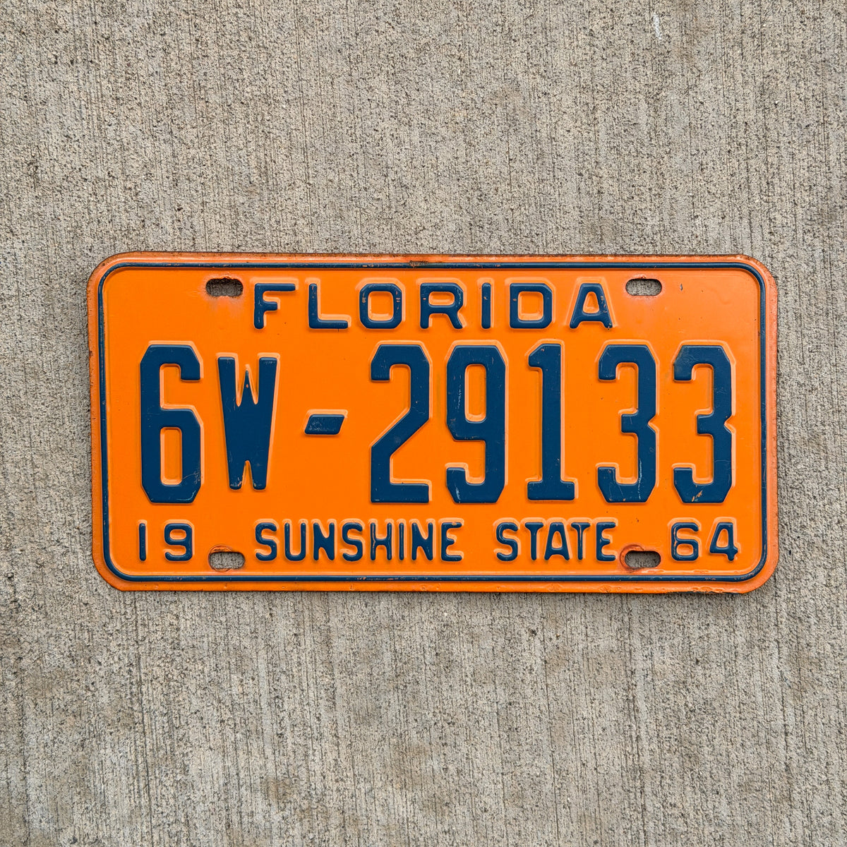 Photo of a 1964 Florida License Plate Auto Tag Garage Decor Vintage DMV Clear 6W 29133 with original patina