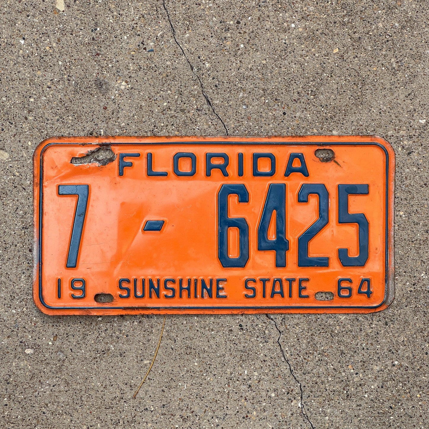 Photo of a 1964 Florida License Plate Auto Tag Garage Decor Vintage Orange County DMV Clear 7 6425 with original patina