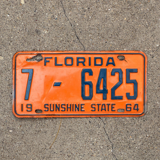 Photo of a 1964 Florida License Plate Auto Tag Garage Decor Vintage Orange County DMV Clear 7 6425 with original patina