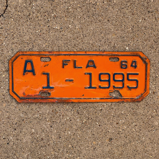 Photo of a 1964 Florida Motorcycle License Plate Auto Tag Garage Decor Vintage 1 1995 with original patina