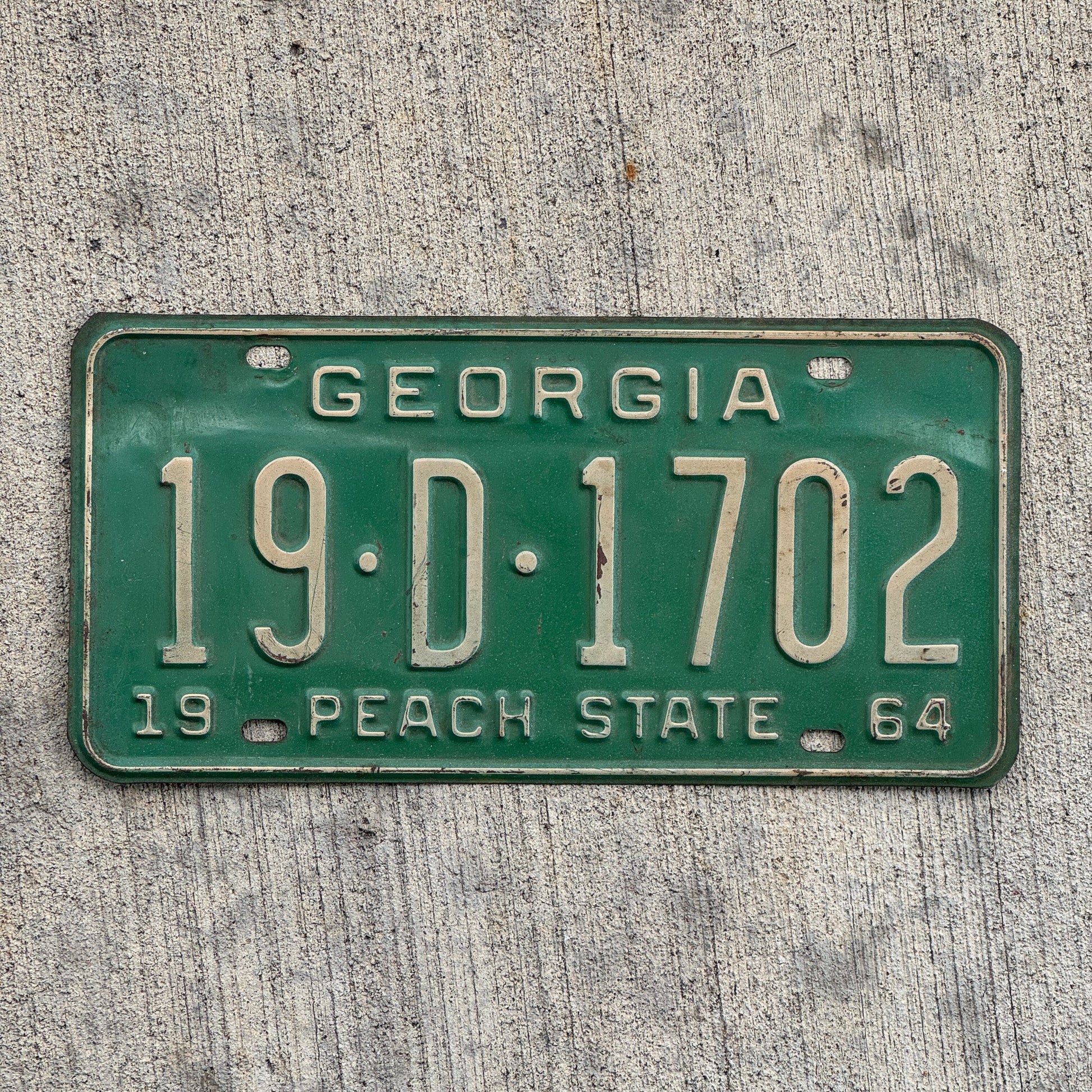 Photo of a 1964 Georgia License Plate Auto Tag Garage Decor Vintage 19 D 1702 with original patina