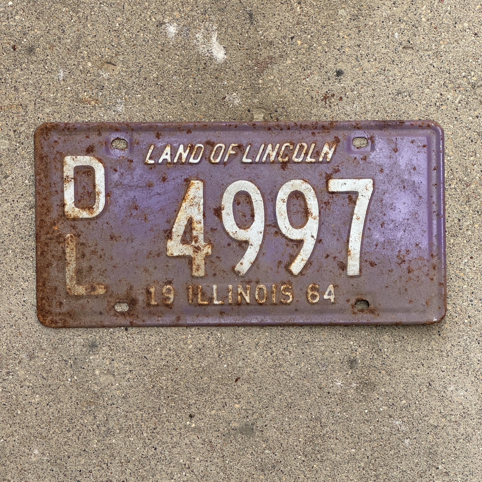 Photo of a 1964 Illinois Dealer License Plate Auto Tag Garage Decor Vintage Purple 4997 with original patina