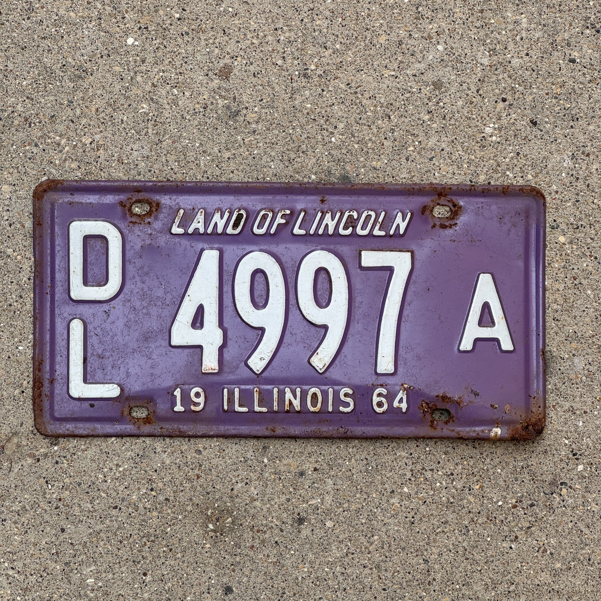 Photo of a 1964 Illinois Dealer License Plate Auto Tag Garage Decor Vintage Purple 4997 A with original patina