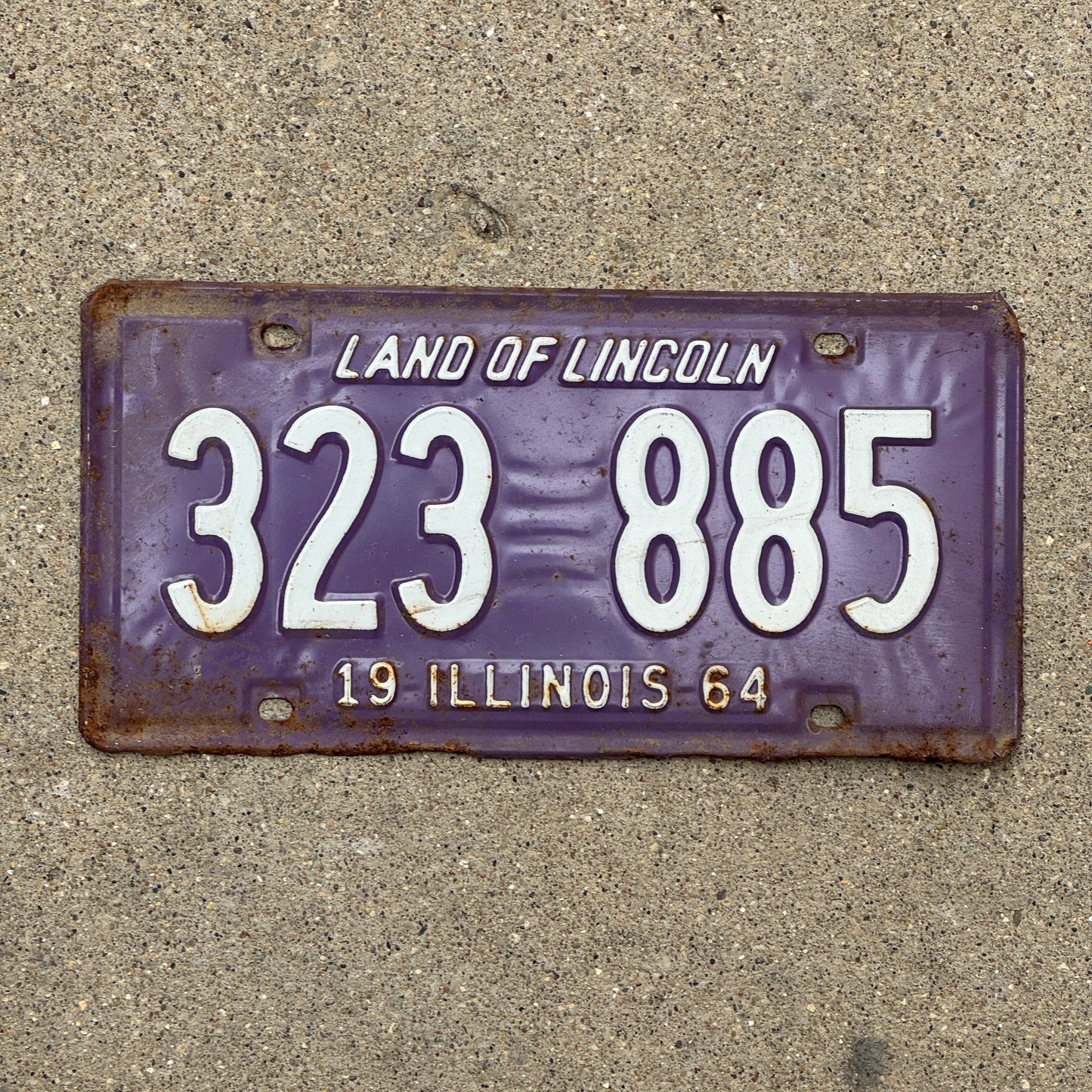 Photo of a 1964 Illinois License Plate Auto Tag 1 Vintage Garage Purple 323 885 with original patina