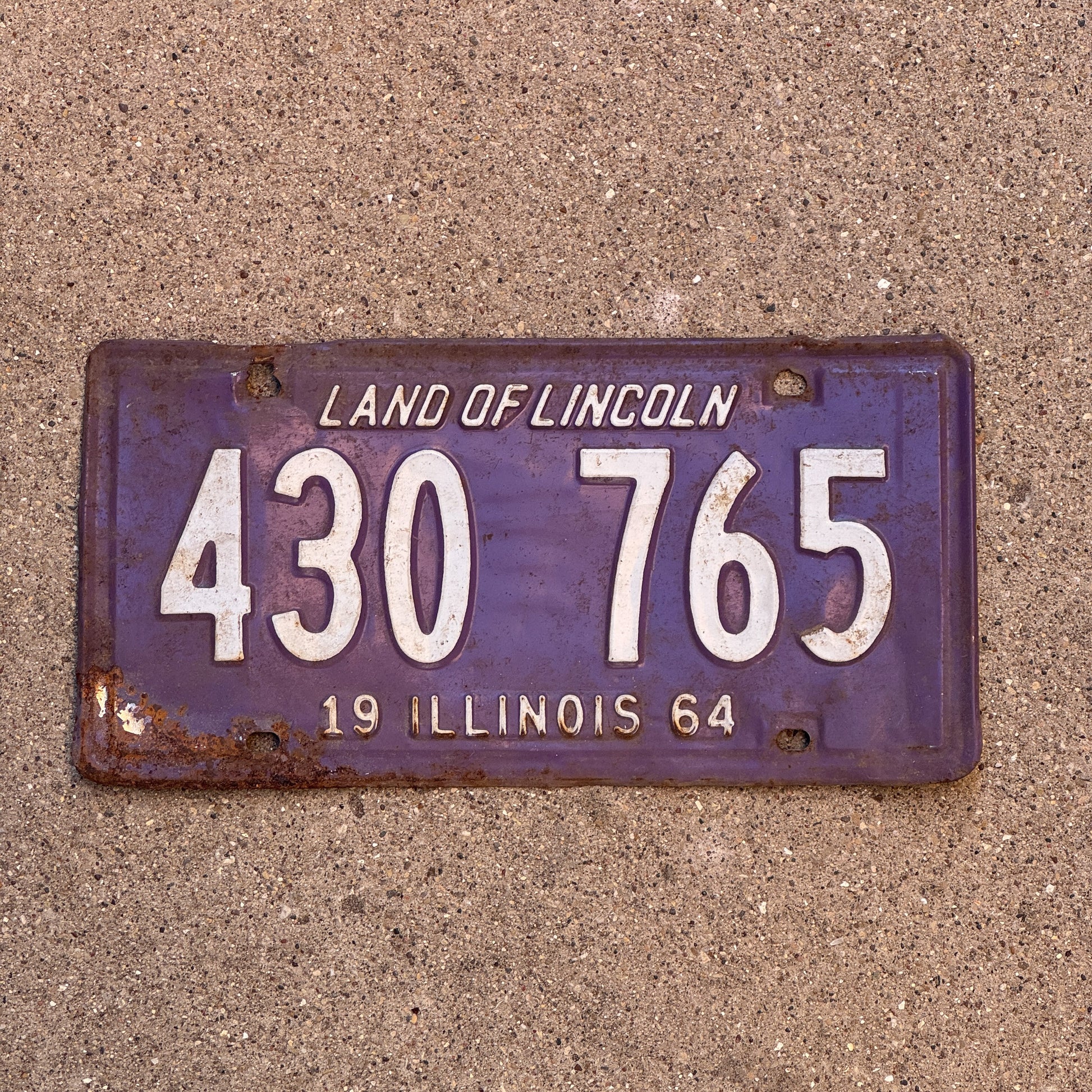 Photo of a 1964 Illinois License Plate Auto Tag 1 Vintage Garage Purple 430 765 with original patina