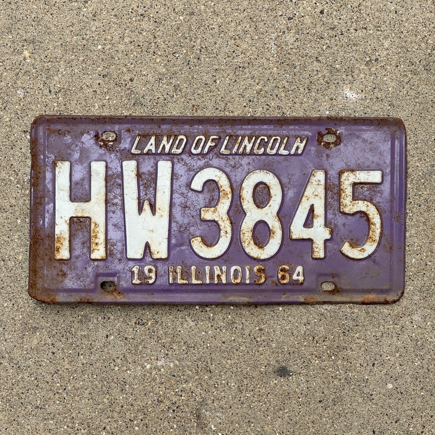 Photo of a 1964 Illinois License Plate Auto Tag 1 Vintage Garage Purple HW 3845 with original patina