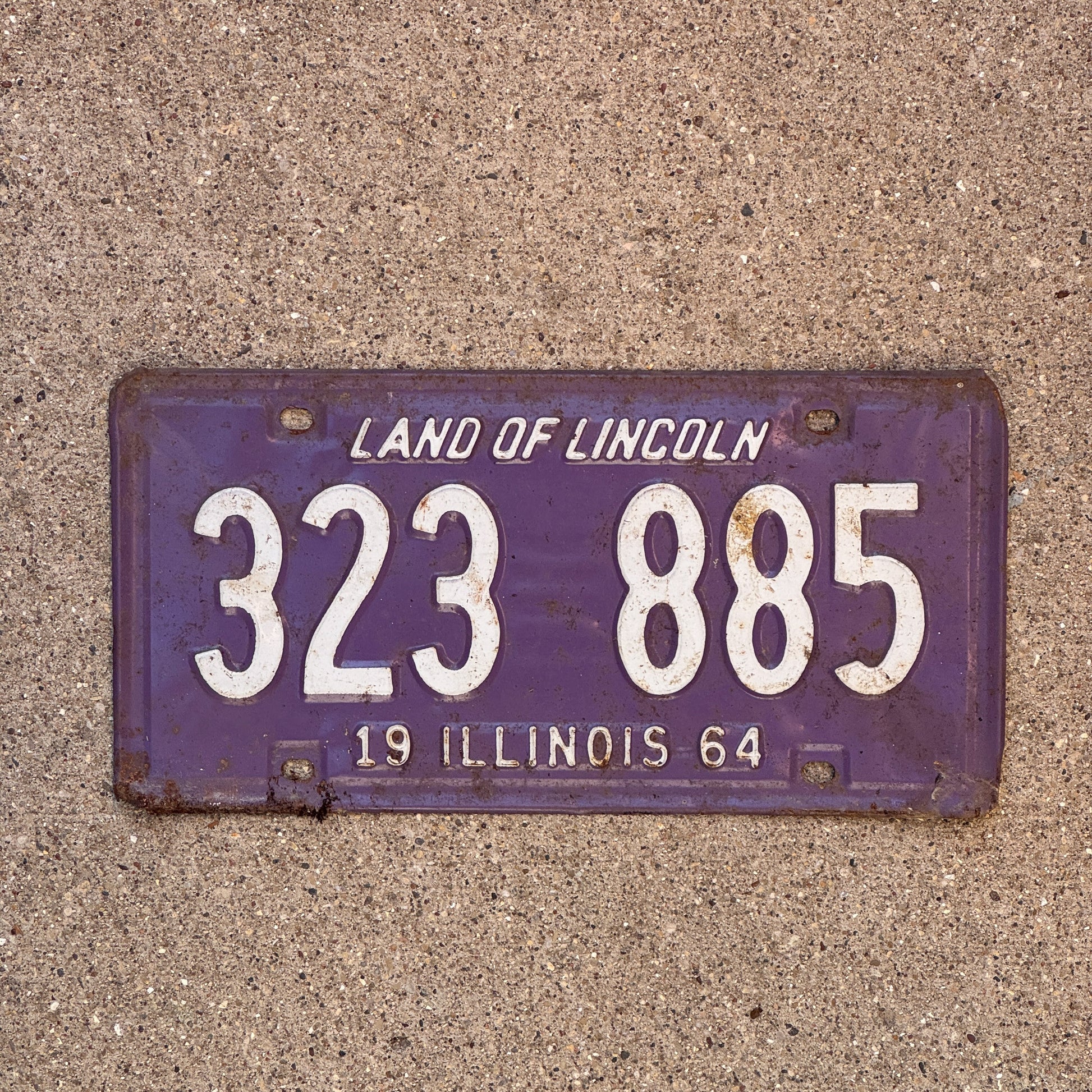 Photo of a 1964 Illinois License Plate Auto Tag 2 Vintage Garage Purple 323 885 with original patina