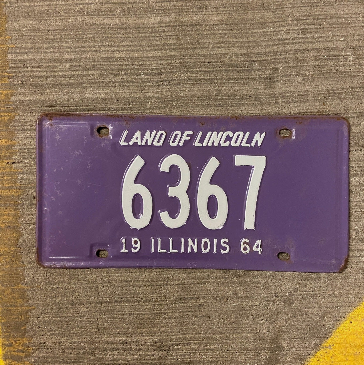Photo of a 1964 Illinois License Plate Auto Tag Garage Decor Vintage Purple Low Number Four Digit 6367 with original patina