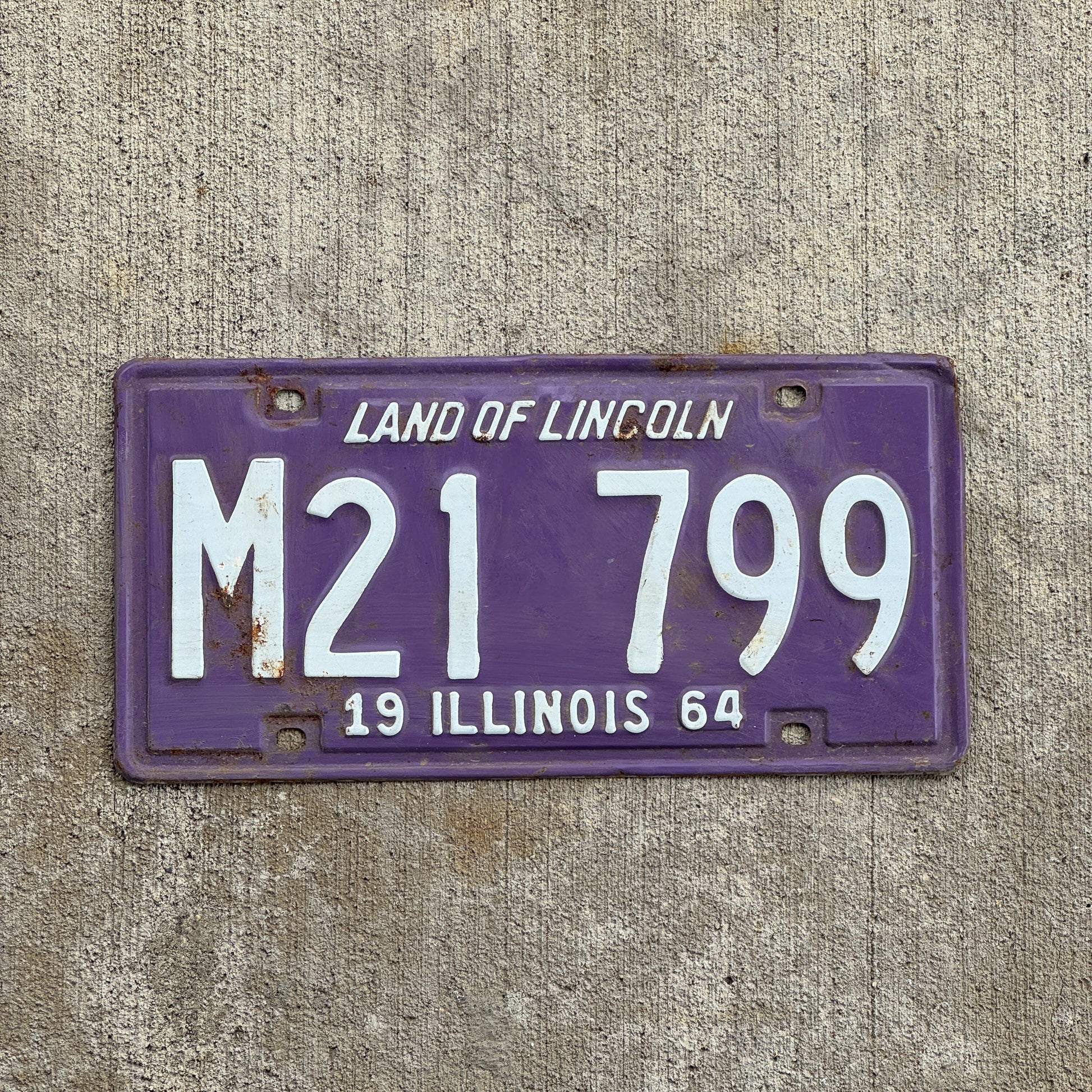 Photo of a 1964 Illinois Municipal License Plate Auto Tag 2 Vintage Garage Purple M 21 799 with original patina