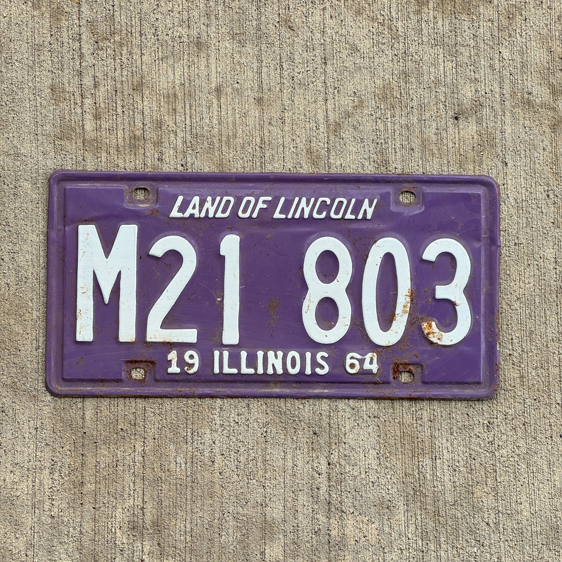 Photo of a 1964 Illinois Municipal License Plate Auto Tag 2 Vintage Garage Purple M 21 803 with original patina