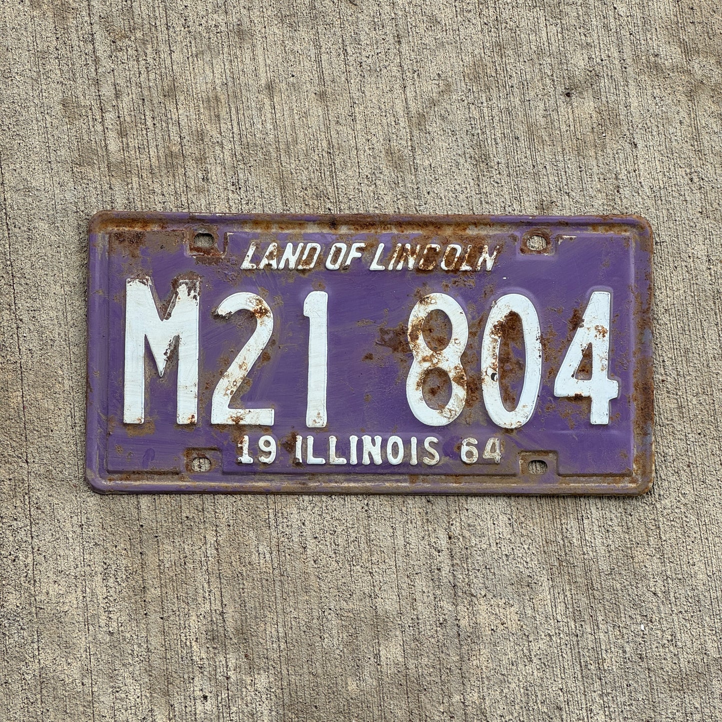 Photo of a 1964 Illinois Municipal License Plate Auto Tag 2 Vintage Garage Purple M 21 804 with original patina