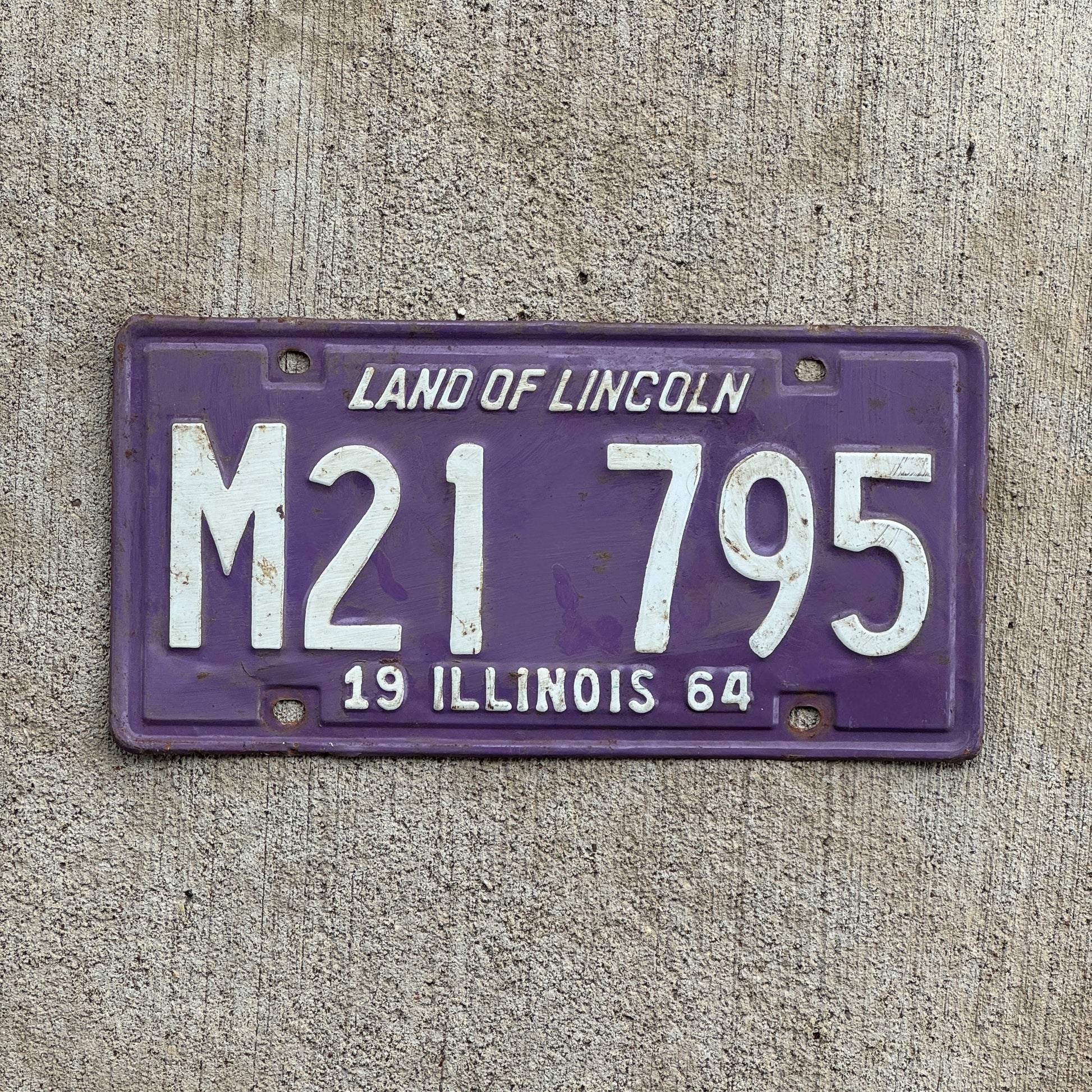Photo of a 1964 Illinois Municipal License Plate Auto Tag Garage Decor Vintage Purple M 21 795 with original patina
