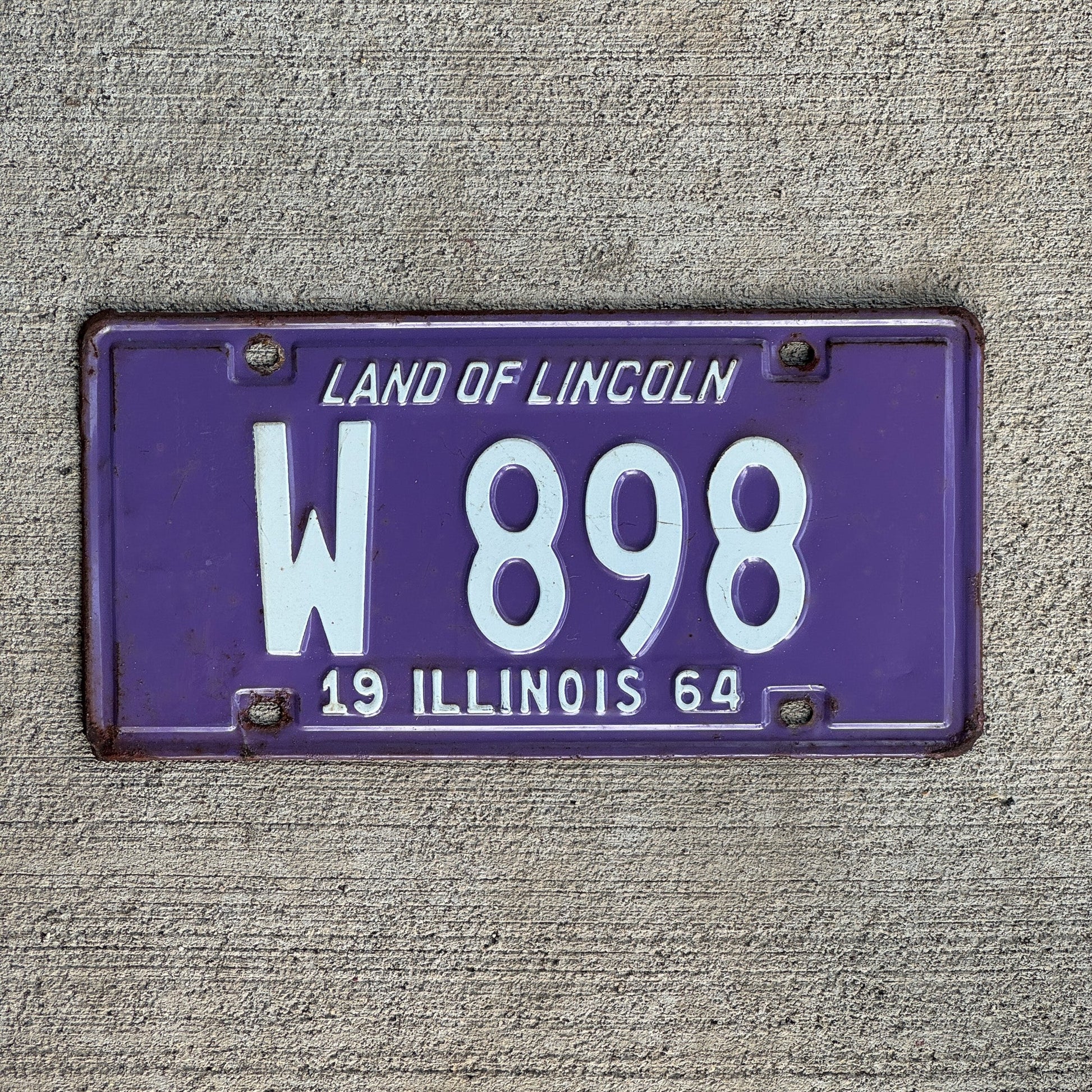 Photo of a 1964 Illinois Trailer License Plate Auto Tag Garage Decor Vintage Low Number Three Digit W 898 with original patina
