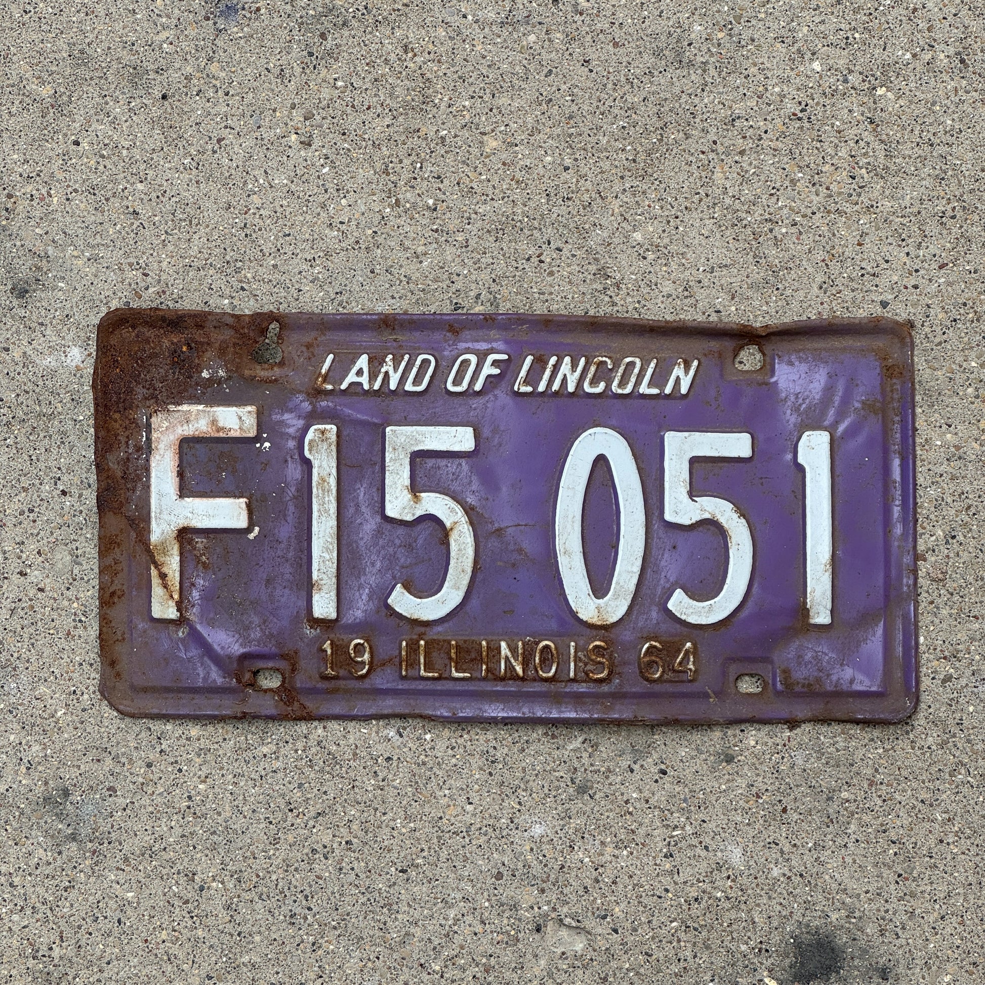Photo of a 1964 Illinois Truck License Plate Auto Tag 1 Vintage Garage Palindrome Purple F 15 051 with original patina