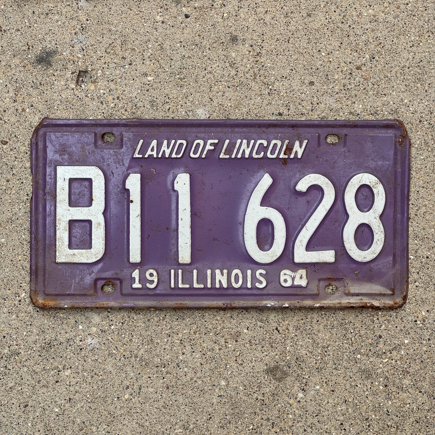 Photo of a 1964 Illinois Truck License Plate Auto Tag 1 Vintage Garage Purple B 11 628 with original patina