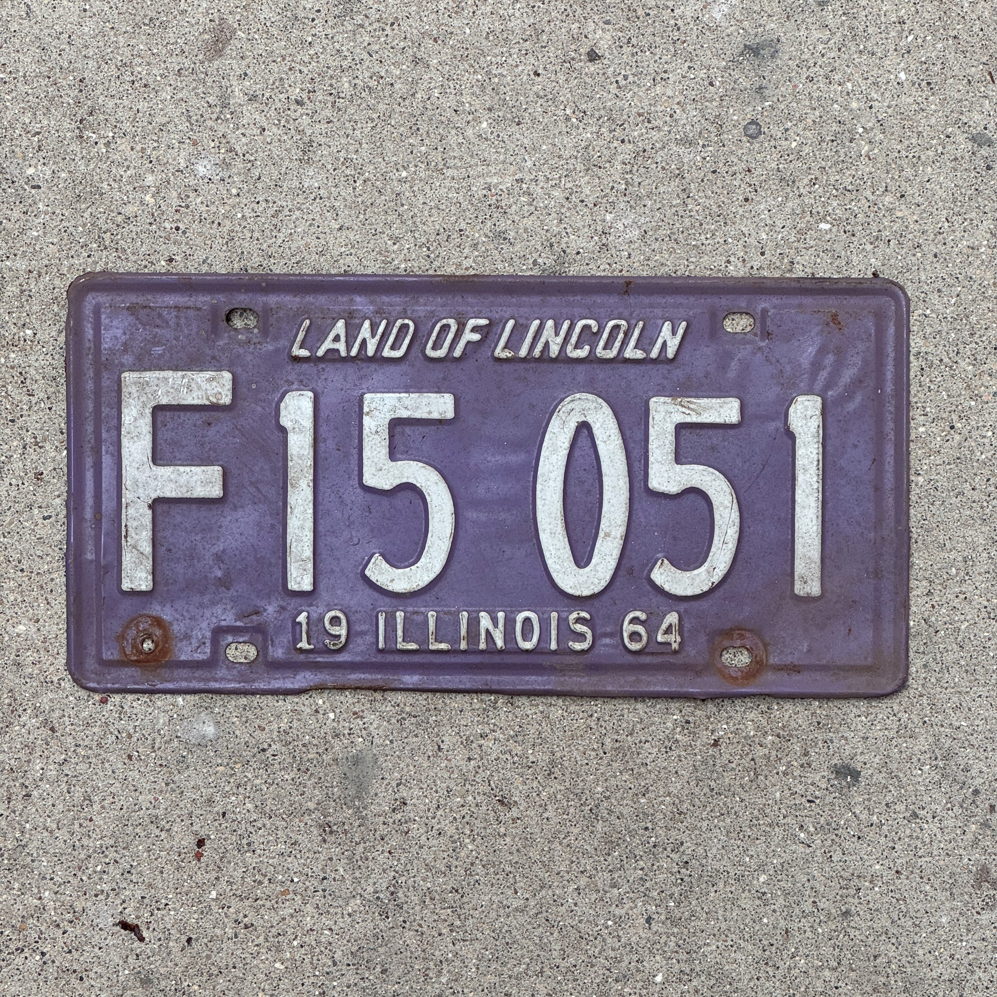 Photo of a 1964 Illinois Truck License Plate Auto Tag 2 Vintage Garage Palindrome Purple F 15 051 with original patina