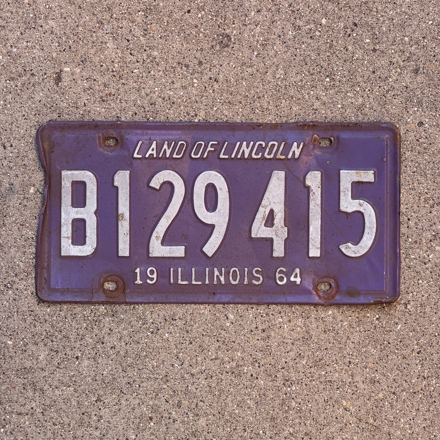 Photo of a 1964 Illinois Truck License Plate Auto Tag Garage Decor Vintage Purple B 129 415 with original patina
