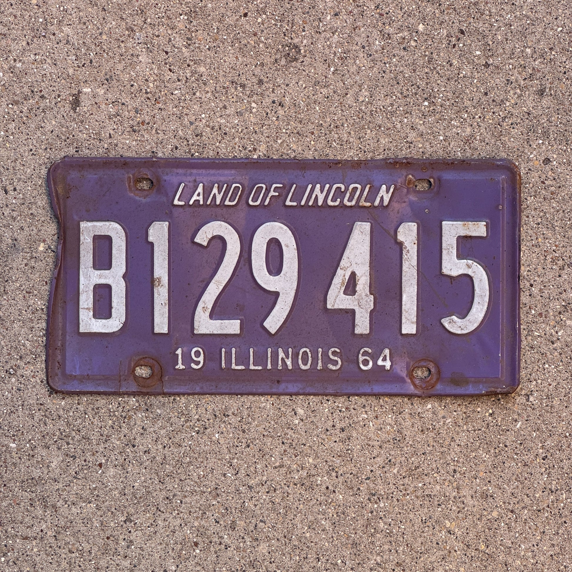 Photo of a 1964 Illinois Truck License Plate Auto Tag Garage Decor Vintage Purple B 129 415 with original patina