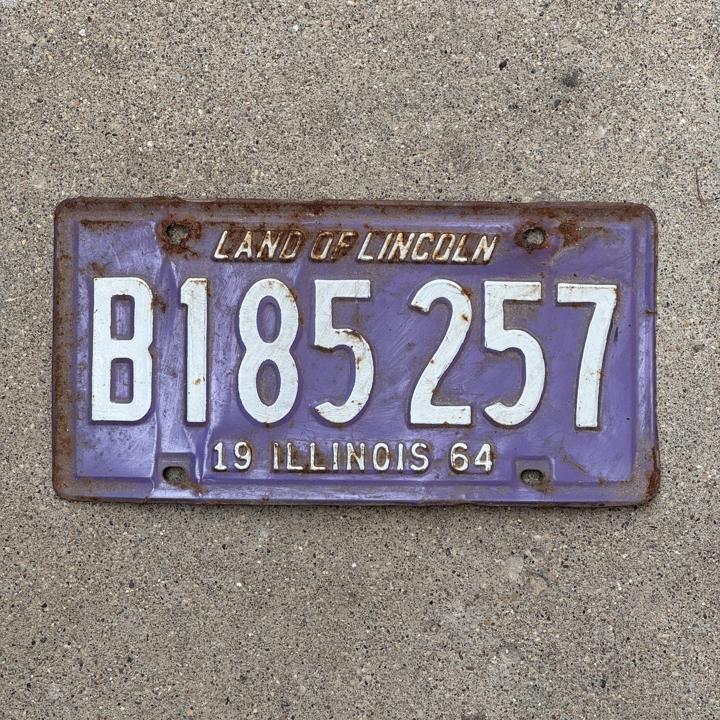 Photo of a 1964 Illinois Truck License Plate Auto Tag Garage Decor Vintage Purple B 185257 with original patina