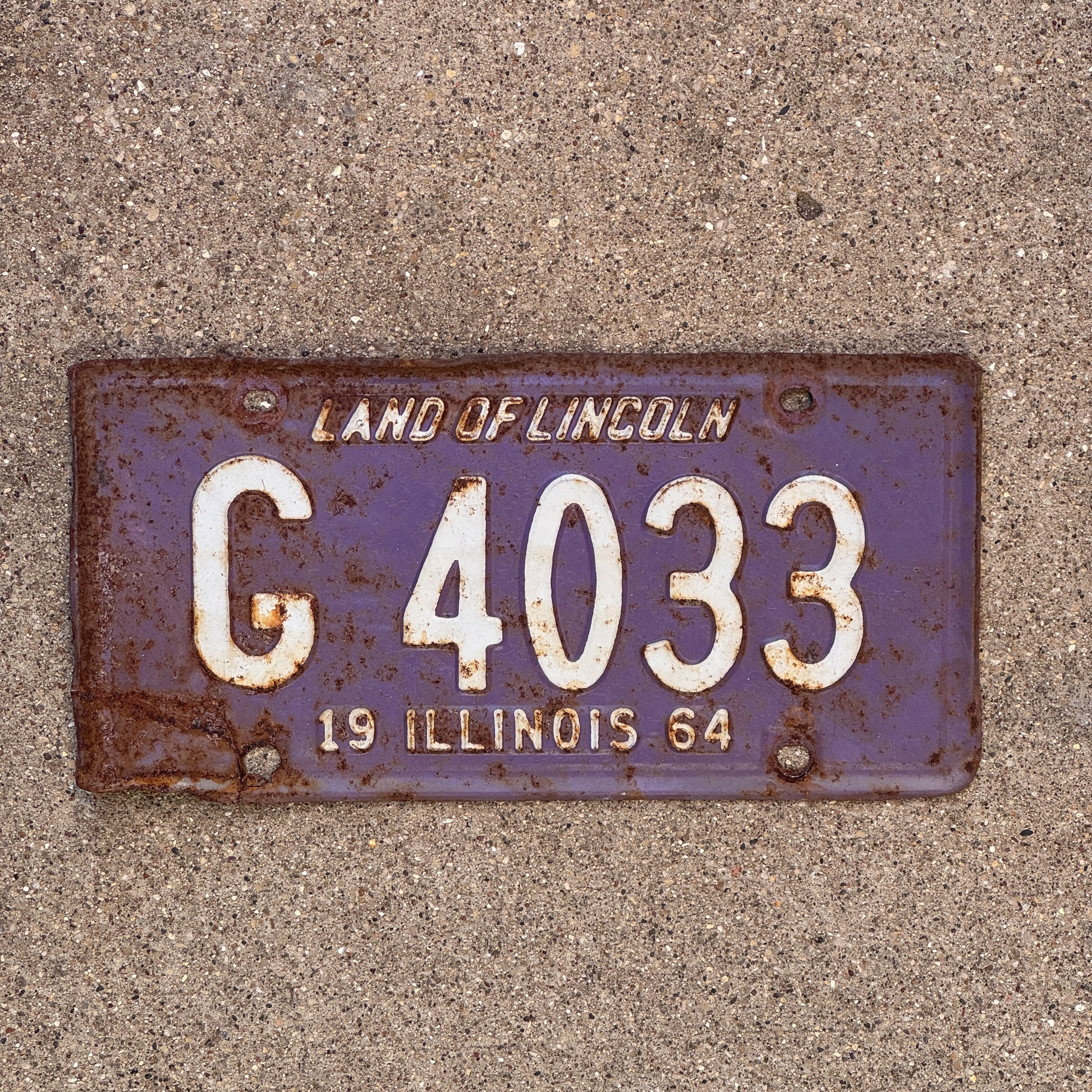 Photo of a 1964 Illinois Truck License Plate Auto Tag Garage Decor Vintage Purple G 4033 with original patina