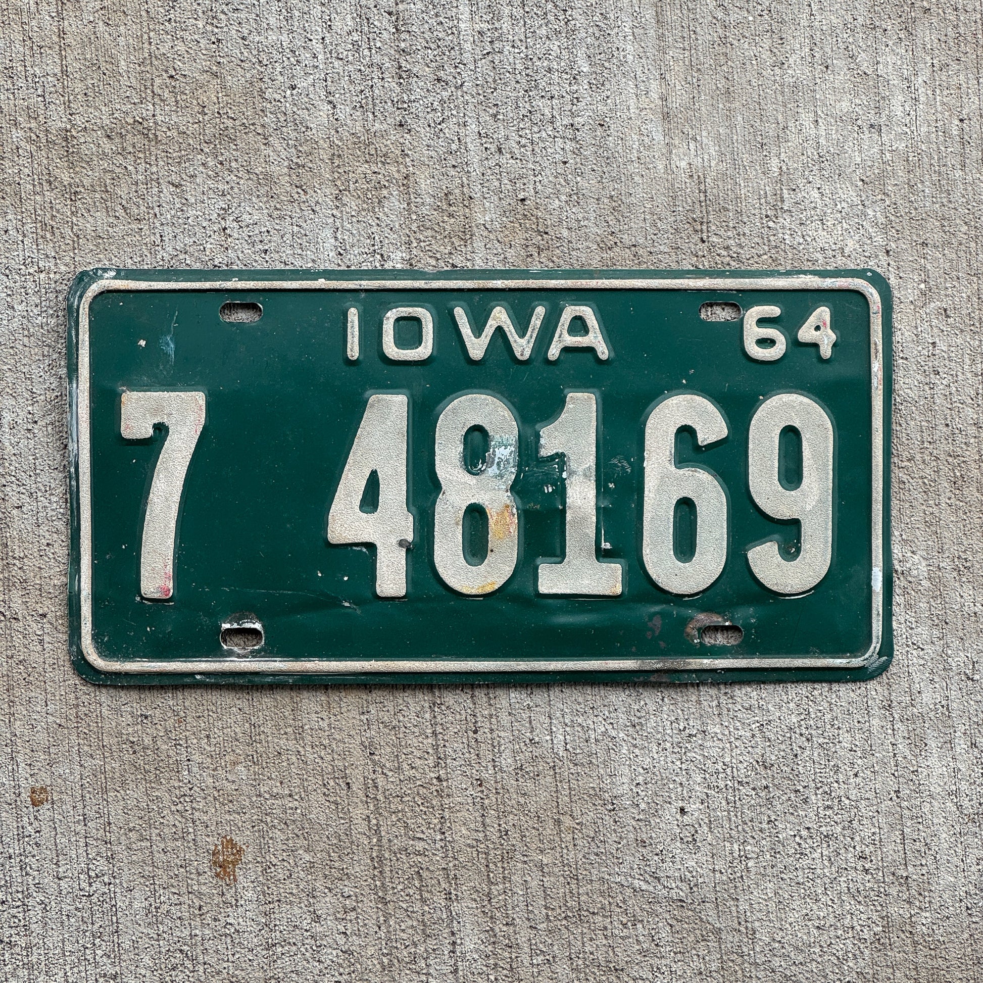 Photo of a 1964 Iowa License Plate Auto Tag Garage Decor Vintage 7 48169 with original patina