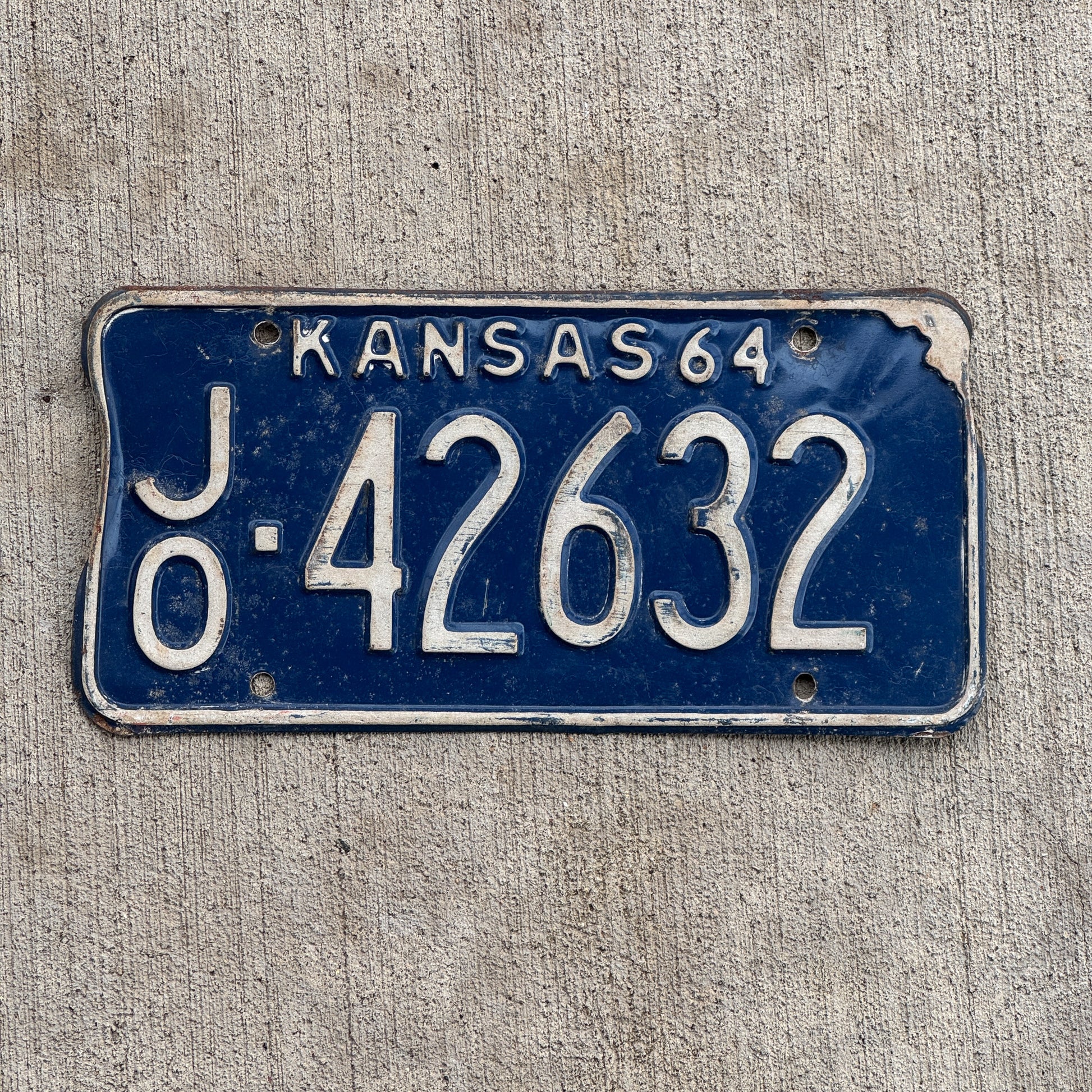 Photo of a 1964 Kansas License Plate Auto Tag Garage Decor Vintage JO 42632 with original patina