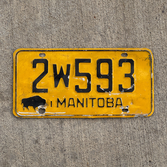 Photo of a 1964 Manitoba License Plate Auto Tag Garage Decor Vintage Buffalo Bison 2 W 593 with original patina